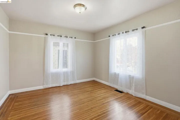 Spare room featuring light wood-style floors and plenty of natural​​‌​​​​‌​​‌‌​​‌​​​‌‌​​​‌​​‌‌​​‌‌​​‌‌​​​​ light