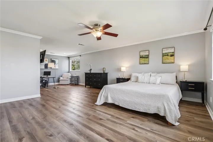 Large primary suite with a spacious layout and room for a sitting area or flexible use