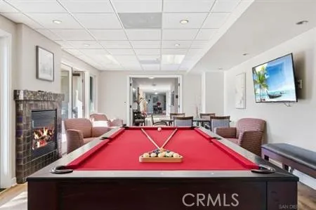 Community recreation room with pool table, big screen TV, fireplace and wet-bar for your enjoyment.
