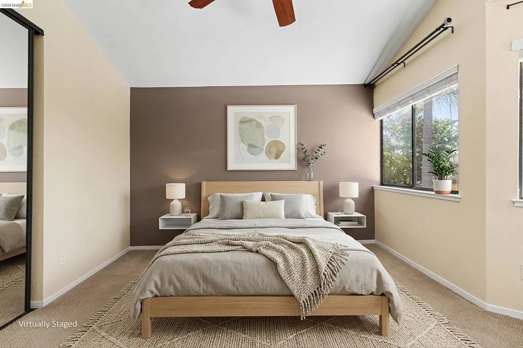Vaulted ceiling with wood-finish ceiling fan