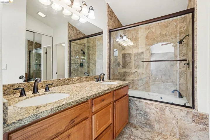 Dual vanity with granite countertop and undermount sinks