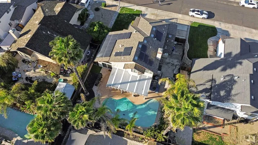 Aerial perspective of suburban area featuring a pool area