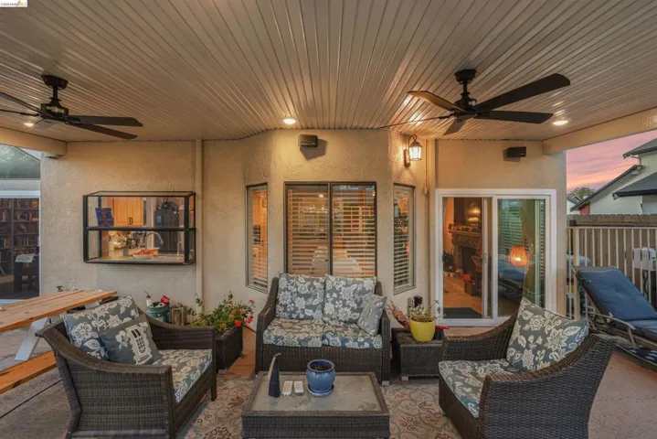 View of patio featuring a ceiling fan and outdoor furniture