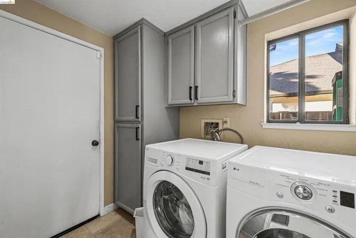 Laundry area with cabinet space and washer and dryer