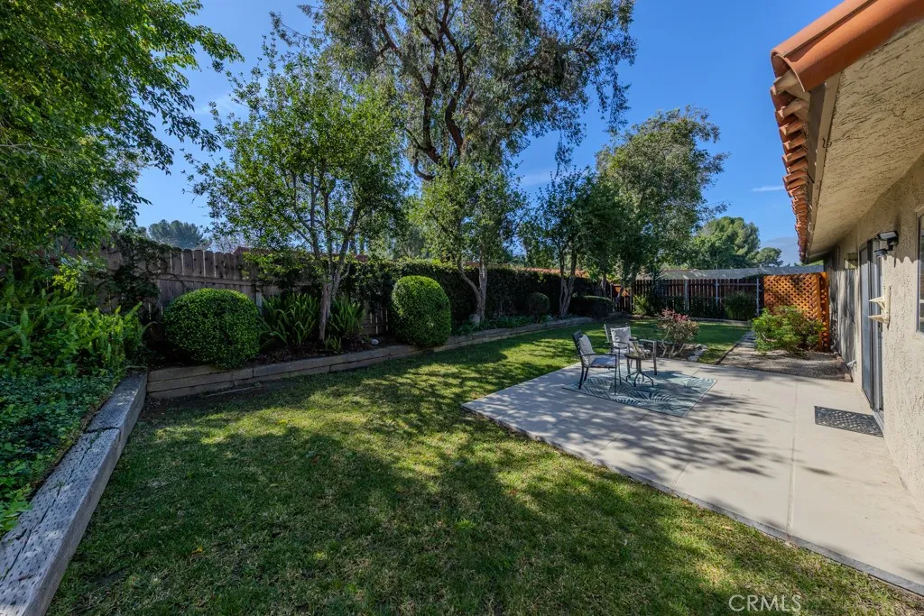 Nice size private back yard with planters