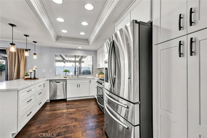 Upgraded Kitchen with Quartz Counter tops, Recessed and Pendant Lighting