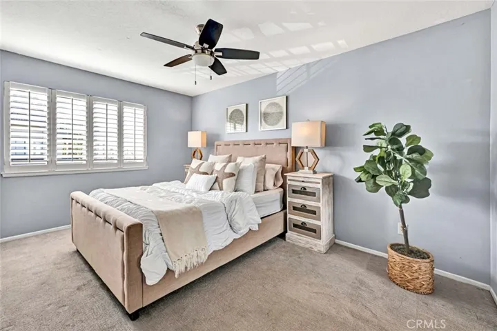 Bedroom 2 Features Custom Shutter and Ceiling Fan