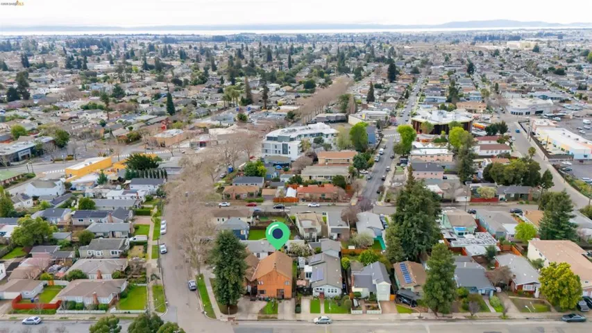 Aerial overview of property's location with nearby suburban area