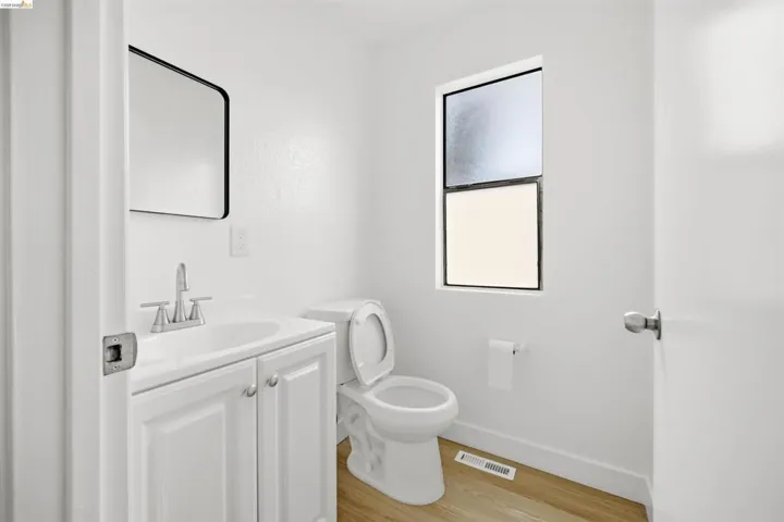 Bathroom with vanity and light wood finished floors
