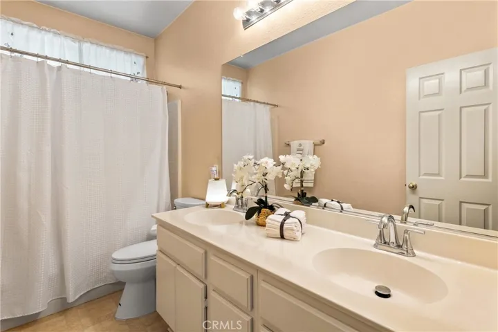 Dual sink hallway bathroom.