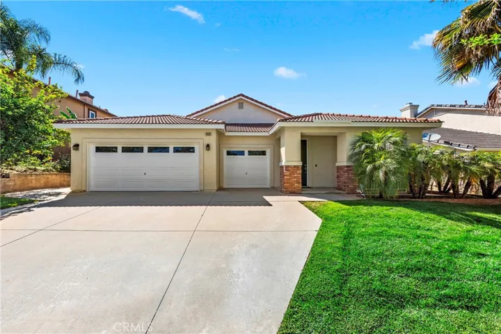 Spacious 3-car garage with ample storage space and direct interior access.