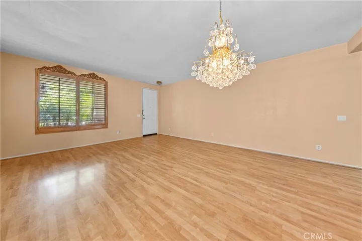 Bright, open-concept living room featuring expansive windows that flood the space with natural light.