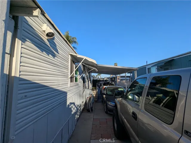 Long drive way with 2 trucks and 1 car