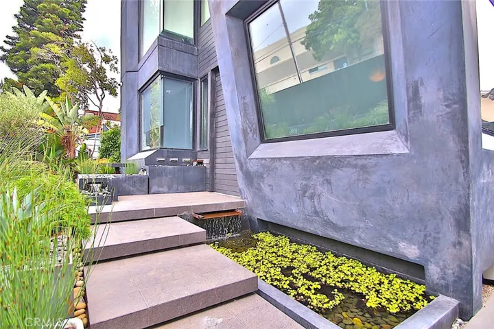 Front entrance with waterfall and pond.