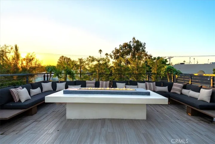 Large firepit with privacy landscaping.