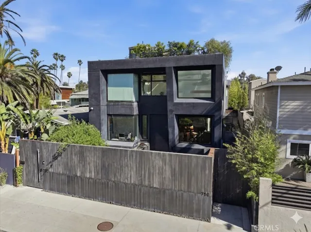 Large privacy fence in front.
