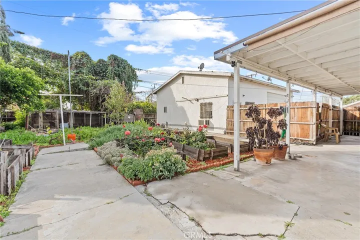 partial view of backyard and additional garage/workspace
