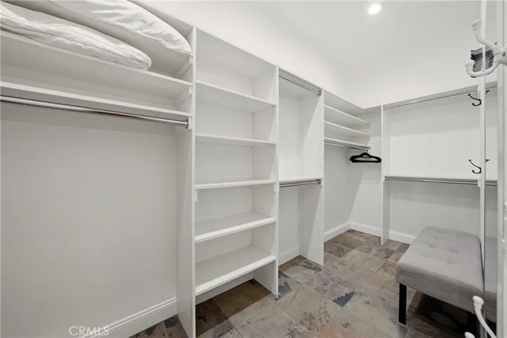 One of two spacious walk-in closets offering ample storage and organization.