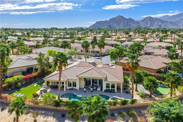 A private desert retreat set on a premium pie-shaped lot, backing to a natural ravine that enhances privacy and mountain vistas.