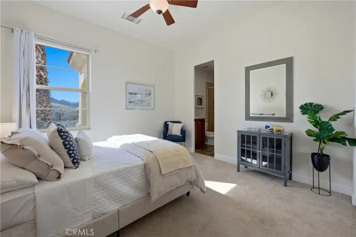 Comfortable guest bedroom with mountain views and a private en-suite bathroom.