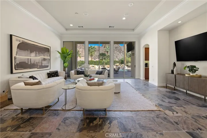 Sliding glass doors open wide to the patio and pool, blending indoor comfort with the resort-style outdoor living that defines White Fox Resort.