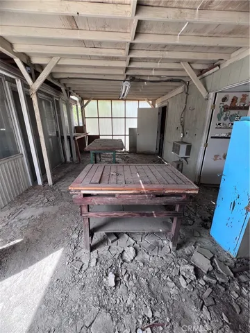 Enclosed patio next to workshop