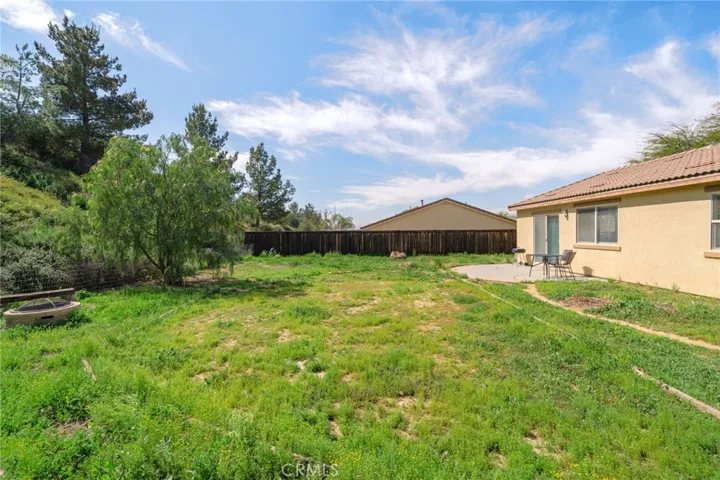 Expand your living space outdoors with the generous yard ready for your personal touch