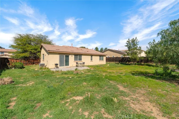 Expansive yard ready for gatherings, gardening, or your dream outdoor space!