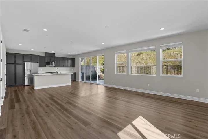 Living Room With Kitchen In Background