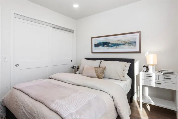 Deep closets with wooden slider doors