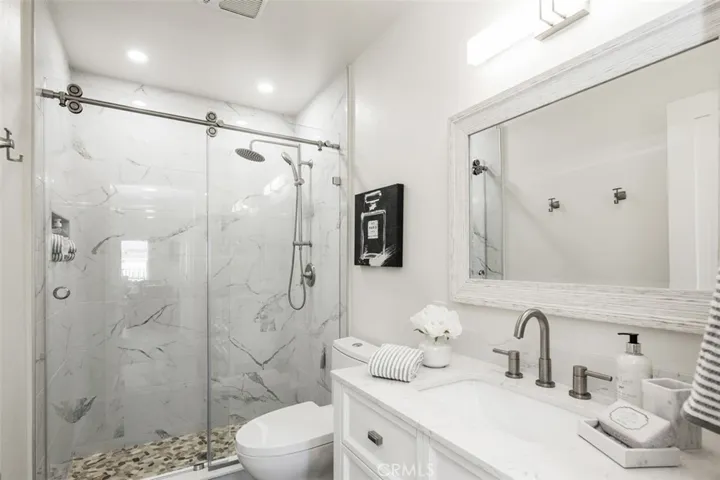 Guest Bath with designer glass barn doors
