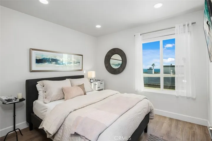 Secondary bedroom with ocean views and beautifully appointed textiles and fully furnished.