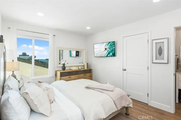 Primary ensuite bedroom with ocean views, walk in closet and fully furnished