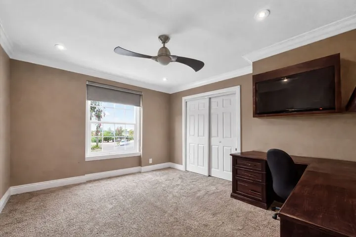 Bedroom with built in desk