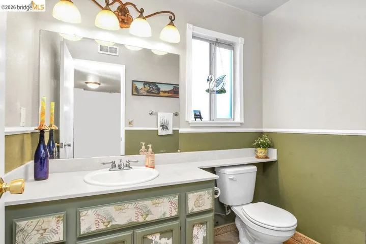 Bathroom with vanity and toilet