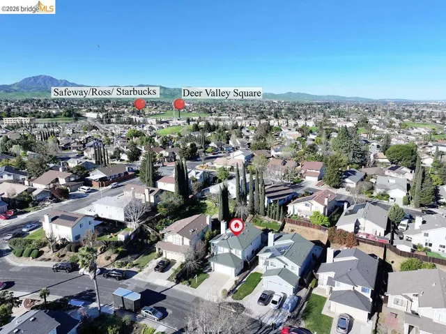 Aerial perspective of suburban area with a mountain backdrop