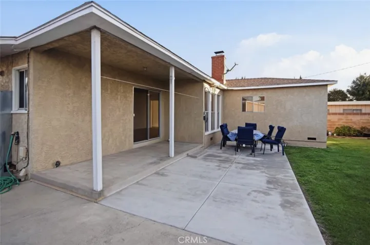 Rear of home with large concerete patio
