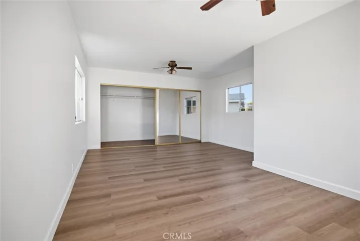 New Floors and Paint walk-in closet with mirrored doors