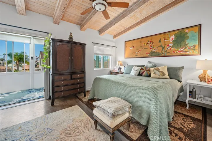 Primary bedroom #2 with cathedral ceiling and attached balcony