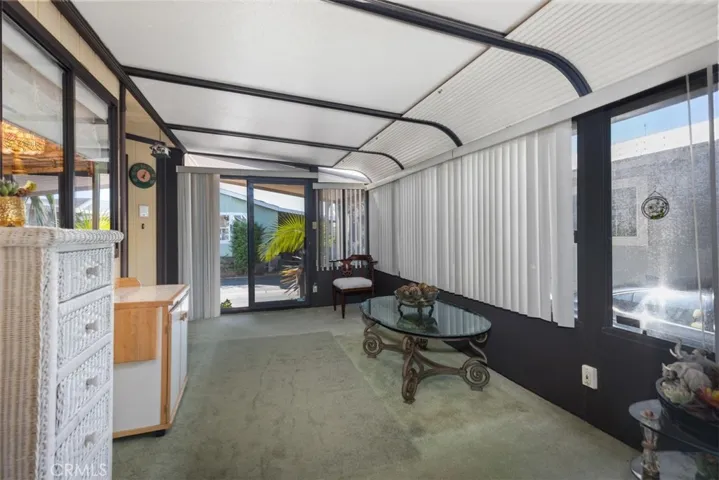 This covered porch/sunroom truly adds to the spaciousness of this home.