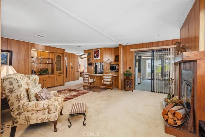Family Room leads to covered sunroom (to right of photo) and kitchen (center of photo)