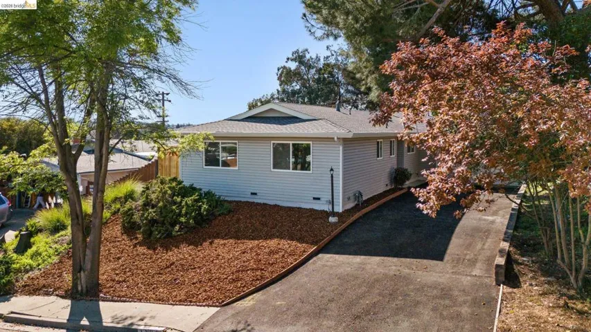 View of property exterior featuring crawl space and a shingled roof