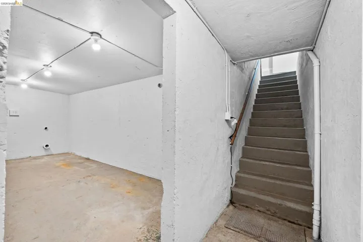 Stairway with unfinished concrete flooring