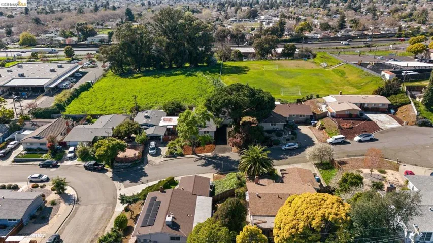 View of property location with nearby suburban area