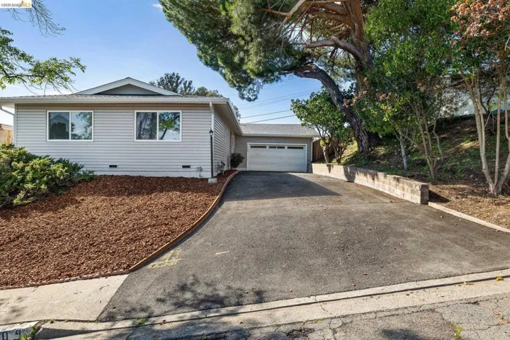 Single story home featuring crawl space, driveway, and a garage