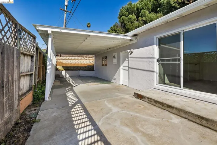 View of patio with an attached carport
