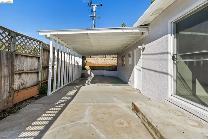 View of patio / terrace featuring an attached carport