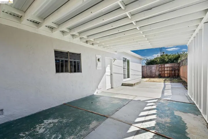 Fenced backyard featuring a patio area