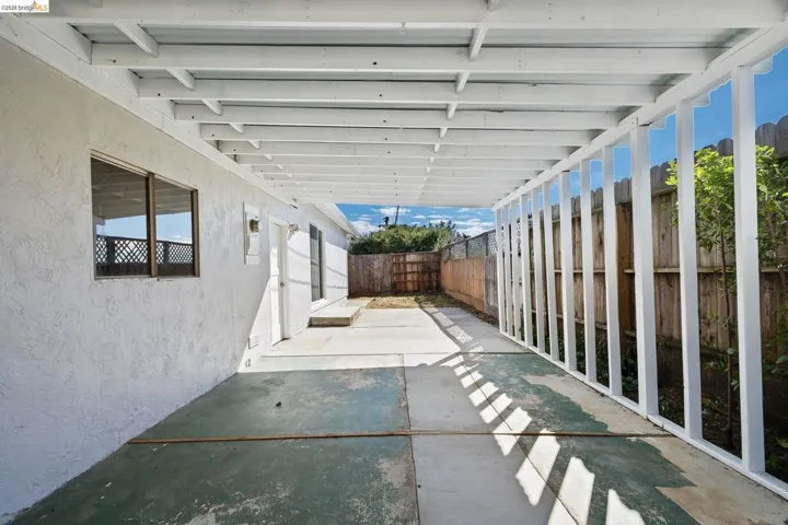 Fenced backyard featuring a patio