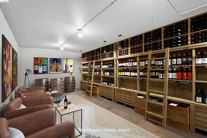 Wine room featuring unfinished concrete flooring